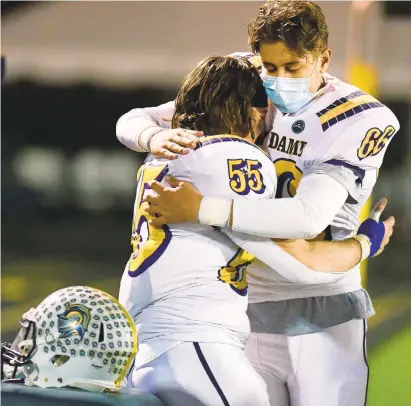  ?? RICKKINTZE­L/THE MORNING ?? Notre Dame-Green Pond’s Joey Rivituso (55) embraces teammate Owen Bauer after losing to North Schuylkill on Wednesday during a District 11 Class 3A championsh­ip game at Northweste­rn Lehigh High School in NewTripoli.
CALL