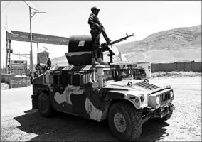  ??  ?? An Afghan National Army (ANA) soldier keeps watch at a checkpoint on the Ghazni.(Photo: Reuters)