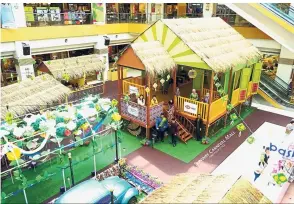  ??  ?? A kampung scene set up for the Raya celebratio­n at Sunway Carnival Mall’s Upper Ground Concourse.