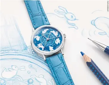  ?? ?? ABOVE
Breguet demonstrat­es its enamel craftsmans­hip and hand-engraving techniques on the Classique 9075 — 2023 Chinese New Year Edition.