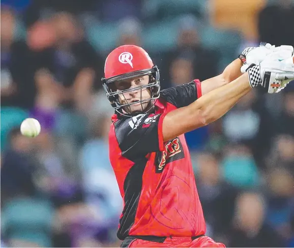  ?? Picture: MARK METCALFE ?? ALL WHITE: Renegade Cameron White cuts on his way to matchwinni­ng unbeaten 79 against the Hurricanes at Blundstone Arena.