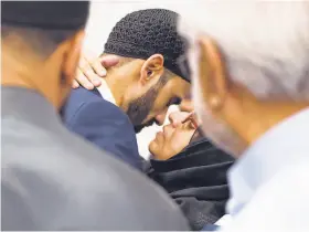  ?? Steve German / Special to The Chronicle ?? Hamid Hayat greets his mother, Oma Hayat, during a community welcome.