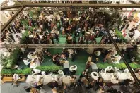  ??  ?? An aerial view of Cafe Girandole at the 2017 San Francisco Fall Art &amp; Antiques Show.