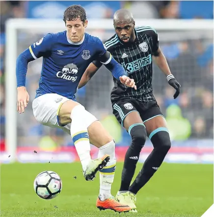  ??  ?? ■ Ross Barkley and Allan Nyom keep their eyes on the ball.