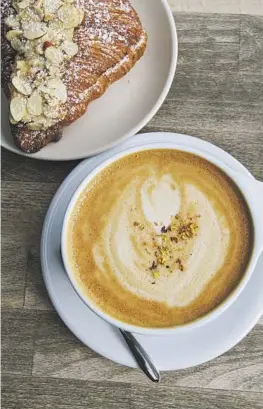  ?? ?? COFFEES out of China’s Yunnan province are becoming more nuanced and f lavorful. Sherry Gao, below, spotlights them at her Mandarin Coffee Stand in Pasadena’s Burlington Arcade, where they’re in espresso shots and lattes infused with tea.