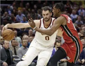  ?? TONY DEJAK — ASSOCIATED PRESS ?? The Cavaliers’ Kevin Love drives against the Heat’s Josh Richardson on Nov. 28.