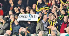  ??  ?? Leaving it late: Lucas Digne (top) hits a sublime equaliser for Everton; (above) Watford fans unveil their ‘snake’ protest against former manager Marco Silva