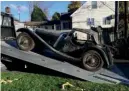  ??  ?? Clockwise from top left: the 1938 SS100 as found by enthusiast Terry Larson; engine has been silent for decades; the Jaguar loaded up and ready for restoratio­n