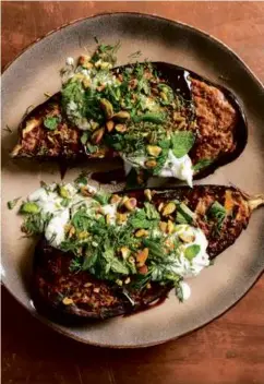  ?? ?? Eggplant With Caramelize­d Tahini and Cucumber-Yogurt Sauce