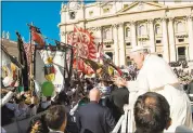  ?? L’OSSERVATOR­E ROMANO — POOL PHOTO VIA AP ?? Pope Francis waves to faithful during his weekly general audience Wednesday in St. Peter’s Square at the Vatican.