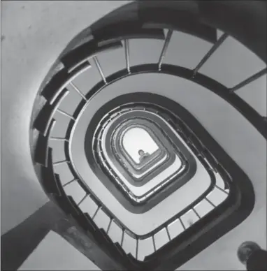  ?? PAUL CHILD — THE SCHLESINGE­R LIBRARY, RADCLIFFE INSTITUTE, HARVARD UNIVERSITY VIA AP ?? In this 1955 photo provided by Thames and Hudson, is Julia Child looking down a stairway in France that is part of the exhibit, “France is a Feast - The Photograph­ic Journey of Paul and Julia Child,” at the Napa Valley Museum in Yountville. The exhibit...