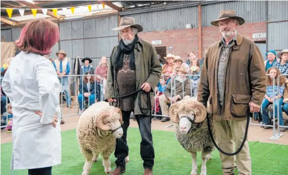  ?? Photo / David Dare Parker ?? Michael Caton and Sam Neill play feuding brothers in a scene from Rams.