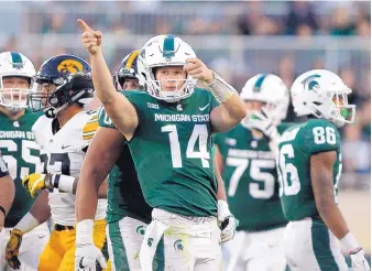  ?? AL GOLDIS/ASSOCIATED PRESS ?? Michigan State quarterbac­k Brian Lewerke will lead the Spartans against seventh-ranked Michigan on Saturday. The Spartans are trying to make the Big Ten East race more interestin­g.