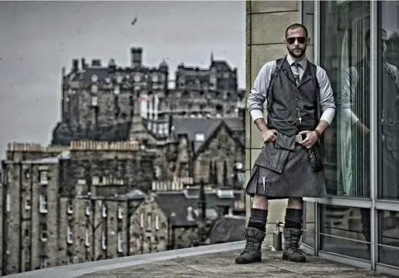  ?? TONY MARSH ?? Howie Nicholsby, owner of 21st Century Kilts, says he has worn a kilt exclusivel­y since 1999. “Wear it like jeans,” he says, as he shows off Edinburgh’s pride in its roots.