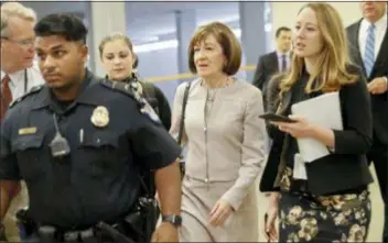  ?? PABLO MARTINEZ MONSIVAIS - THE AP ?? Sen. Susan Collins, R-Maine, is followed by members of the media as she walks to the Capitol before a vote to advance Brett Kavanaugh’s nomination to the Supreme Court, on Capitol Hill, Friday in Washington.