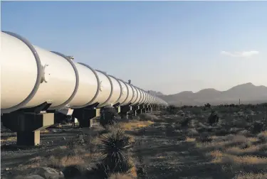  ?? Photos by Bridget Bennett / New York Times ?? Above: The test track for a hyperloop pod in Moapa, Nev. Hyperloop technology, which promises to transport people and goods very quickly, has moved a little closer to reality. Below: The inside of the pod.