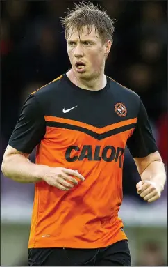  ??  ?? Talented striker: Moore playing for Dundee United last year