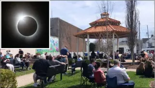  ?? ?? BIG OCCASION: The crowd gathered in Norwalk to watch the eclipse. Inset: The eclipse is captured. Picture: The Norwalk Reflector.