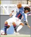  ??  ?? New England Revolution defender Jose Goncalves (left), and Montreal Impact forward Michael Salazar (right), vie for the ball during the first half of an MLS soccer game on Oct
23, in Foxborough, Mass. (AP)