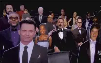  ??  ?? Host Jimmy Kimmel speaks surrounded by cardboard cutouts of actors in the audience during the 72nd Emmy Awards broadcast.