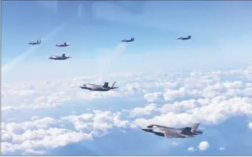  ?? SOUTH KOREAN DEFENCE MINISTRY/AFP ?? South Korean F-15K fighter jets and US F-35B stealth jet fighters fly over South Korea during a joint military drill yesterday, aimed to counter North Korea’s latest missile test.