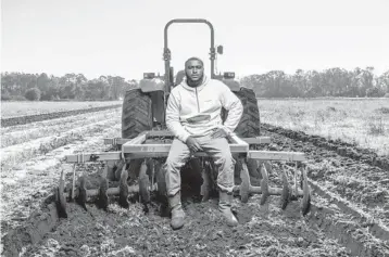  ??  ?? Sedrick Rowe on his farm outside Albany, Georgia. The Biden administra­tion is enlisting the agricultur­e industry in its ambitious plan to fight global warming at the same time it is pledging to help Black farmers.