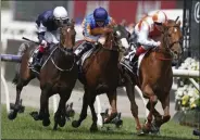  ?? SCOTT BARBOUR - THE ASSOCIATED PRESS ?? Jockey Craig Williams, right, rides Vow and Declare to victory in the Melbourne Cup in Melbourne, Australia, Tuesday, Nov. 5, 2019.