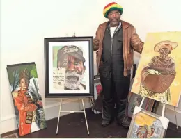  ?? PAT A. ROBINSON / MILWAUKEE JOURNAL SENTINEL ?? Willie Weaver-Bey shows four of the several hundred paintings in his new home in the Sherman Park neighborho­od. His painting, “A Veteran, Not Homeless,” shown at his right, earned first place in the pastels category at the 2016 National Veterans...