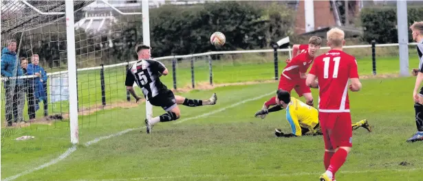  ?? Pictures by Paul Watson ?? Tom Crawford and Mark Reed watch as Barnton clear one off the line and (inset below) Paul McManus makes it 3-1 from the penalty spot