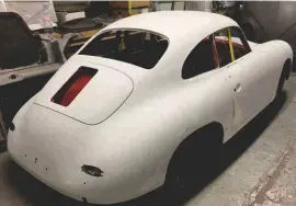  ??  ?? Below left and right: Once the bodywork had been fettled (the only repairs needed were to the doors and sill), it was time for the high-build primer and first hand-flatted colour coats