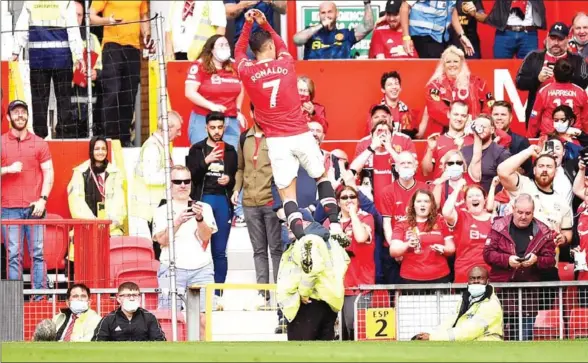  ?? AFP ?? Ronaldo celebrates after scoring the opening goal of the English Premier League football match between against Newcastle on Saturday.