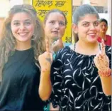  ??  ?? Young voters shows their inked fingers after casting their vote outside a polling station in Pathankot on Wednesday. SAMEER SEHGAL/HT