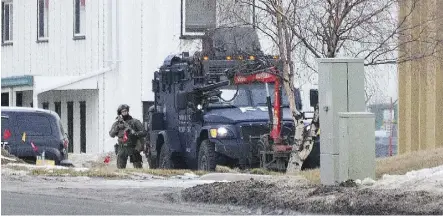  ??  ?? Police are seen at the scene of a standoff in an industrial area of Sherwood Park early Tuesday morning.