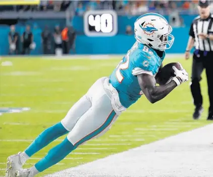  ?? BRYNN ANDERSON/AP ?? Dolphins wide receiver Preston Williams catches a pass near the sideline during a preseason game against the Atlanta Falcons on Thursday.