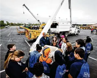  ?? JIM NOELKER/STAFF ?? Around 800 fourth graders from all over the Miami Valley participat­ed in the 2022 Dayton Public School Vehicle Day. Student explored different careers connected to the vehicles and the people who use them.