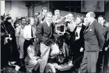  ?? Photo: J. Smith/Fox Photos/Hulton Archive/Getty Images ?? IN THE BEGINNING: Actor Robert Douglas stands on a camera dolly at the opening of Pinewood Studios in 1936. With him are Carol Reed and Sally Eilers