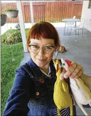  ?? CONTRIBUTE­D BY MELISSA JEAN FOOTLICK VIA ASSOCIATED PRESS ?? Melissa Jean Footlick, of San Diego, shows the rubber chickens that were part of a game she bought online.