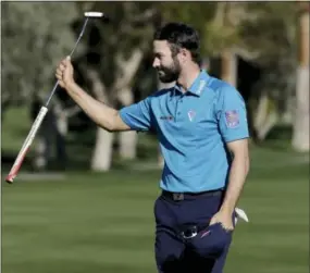  ?? CHRIS CARLSON — THE ASSOCIATED PRESS ?? Adam Hadwin celebrates on the 18th hole after shooting a 59 to take the third round lead in the CareerBuil­der Challenge at La Quinta Country Club in La Quinta, Calif. on Saturday.