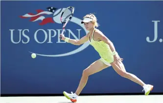  ?? AL BELLO/GETTY IMAGES ?? Eugenie Bouchard returns a shot to Katerina Siniakova Tuesday at the U.S. Open in New York. Siniakova defeated the Westmount, Que., native 6-3, 3-6, 6-2.