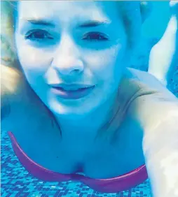  ??  ?? Water babe… Holly Willoughby took a dive for this holiday snap