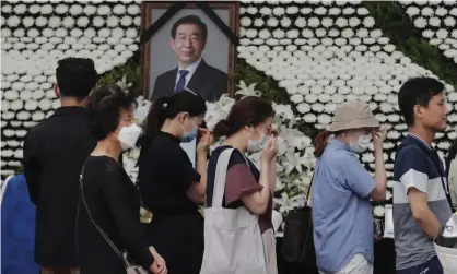  ??  ?? Mourners pass by a memorial altar for Seoul mayor, Park Won-soon, who was reportedly implicated in a sexual harassment complaint. Photograph: Ahn Young-joon/AP