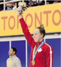  ?? FRANK GUNN/ The Canadian Press ?? Kierra Smith celebrates her women’s 200-metre breaststro­ke final swimming event goal medal at the 2015 Pan Am Games.