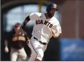  ?? NHAT V. MEYER — BAY AREA NEWS GROUP ?? The Giants’ Brandon Belt heads to third base on a double by Evan Longoria against the San Diego Padres in the eighth inning Sunday in San Francisco.