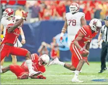  ?? [BRYAN TERRY/THE OKLAHOMAN] ?? Houston defenders had plenty to celebrate three years ago against Oklahoma, including a fumble recovery by Howard Wilson, right. The Sooners and Cougars meet again in a season opener on Sunday. Will lessons learned in that 2016 loss help OU this time around?