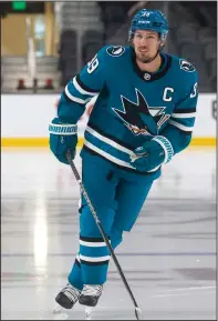  ?? NHAT V. MEYER/BAY AREA NEWS GROUP ?? Sharks captain Logan Couture skates on the ice wearing the Sharks’ 2022 jersey during an event for season ticket holders in San Jose on Sept. 14, 2022.