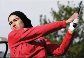  ?? AP/NATI HARNIK ?? Nebraska’s Noor Ahmed is believed to be the only golfer at the college level or higher who competes in a hijab, the headscarf worn in adherence to the Muslim faith. Growing up in the post-9/11 era, Ahmed has been a target for bullying and verbal abuse. But she said she received most of the face-to-face insults before she arrived at Nebraska.