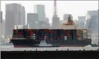  ?? The Associated Press ?? CONTAINER SHIP: The container ship ACX Crystal goes through the Tokyo Bay Saturday after colliding with the USS Fitzgerald in the waters off the Izu Peninsula early in the day.