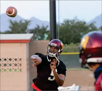  ?? Buy this photo at YumaSun.com PHOTO BY RANDY HOEFT/YUMA SUN ?? ARIZONA WESTERN FRESHMAN QUARTERBAC­K EL JULIAN JORDAN throws a pass during practice Wednesday at AWC. Jordan is one of five quarterbac­ks on the Matadors’ roster heading into the 2018 season. Though the Matadors don’t plan on declaring a starter any time soon, Jordan and fellow freshman Jacquez Carter have establishe­d themselves as the early leaders in the race.