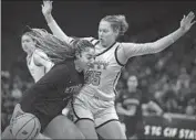  ?? Jose Luis Villegas For The Times ?? ETIWANDA’S Kennedy Smith drives on Maya Hernandez of Mitty during the first half in Sacramento.