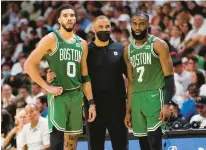  ?? LYNNE SLADKY/AP ?? Celtics head coach Ime Udoka speaks to Jayson Tatum and Jaylen Brown during the Eastern Conference finals playoff series against the Heat on May 17 in Miami.
